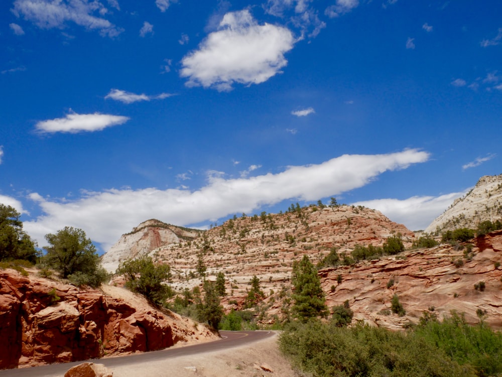 brown rocky mountain under blue sky during daytime