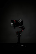 black dslr camera on black tripod