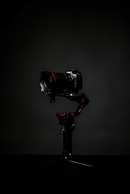 black dslr camera on black tripod