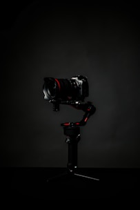 black dslr camera on black tripod