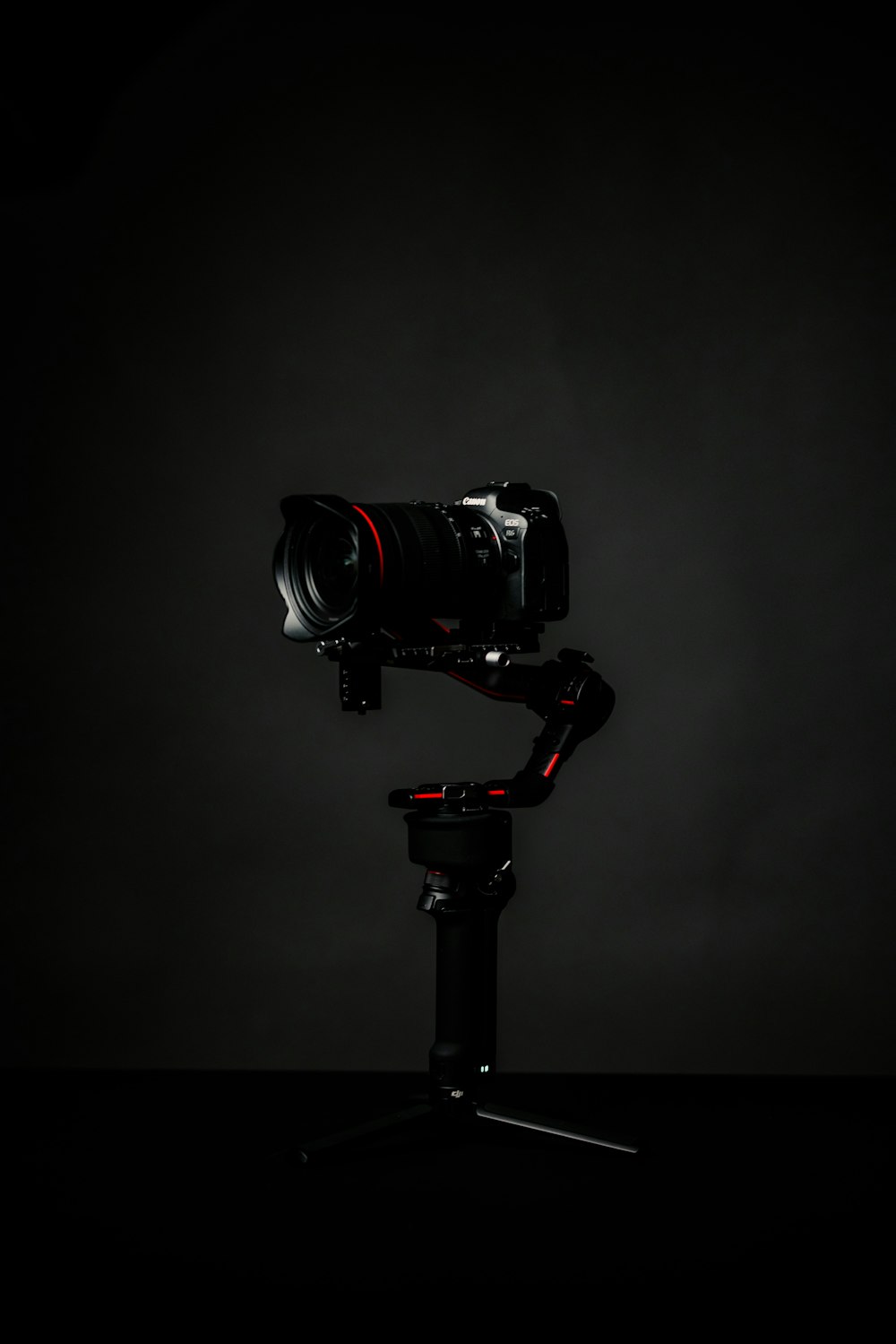 black dslr camera on black tripod