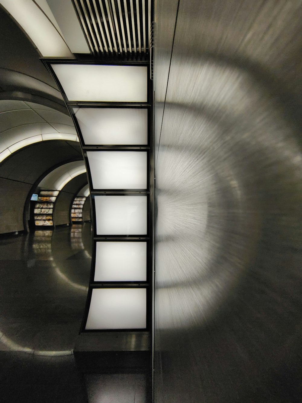 white and black hallway with lights