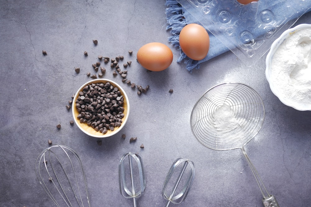 orange egg beside stainless steel spoon