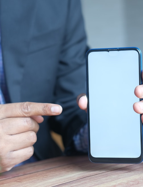 person holding black iphone 5