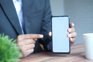 person holding black iphone 5