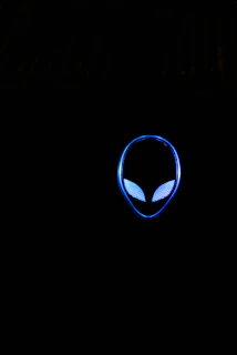 Close-up of a retro alien character wearing a vintage jacket with glowing patterns.