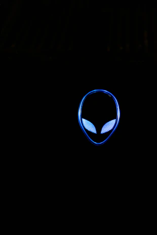 A minimalist black and white logo concept with electric blue accents glowing subtly around sharp, bold typography.