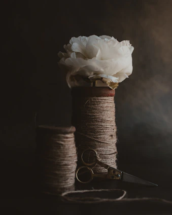 white rose on brown thread