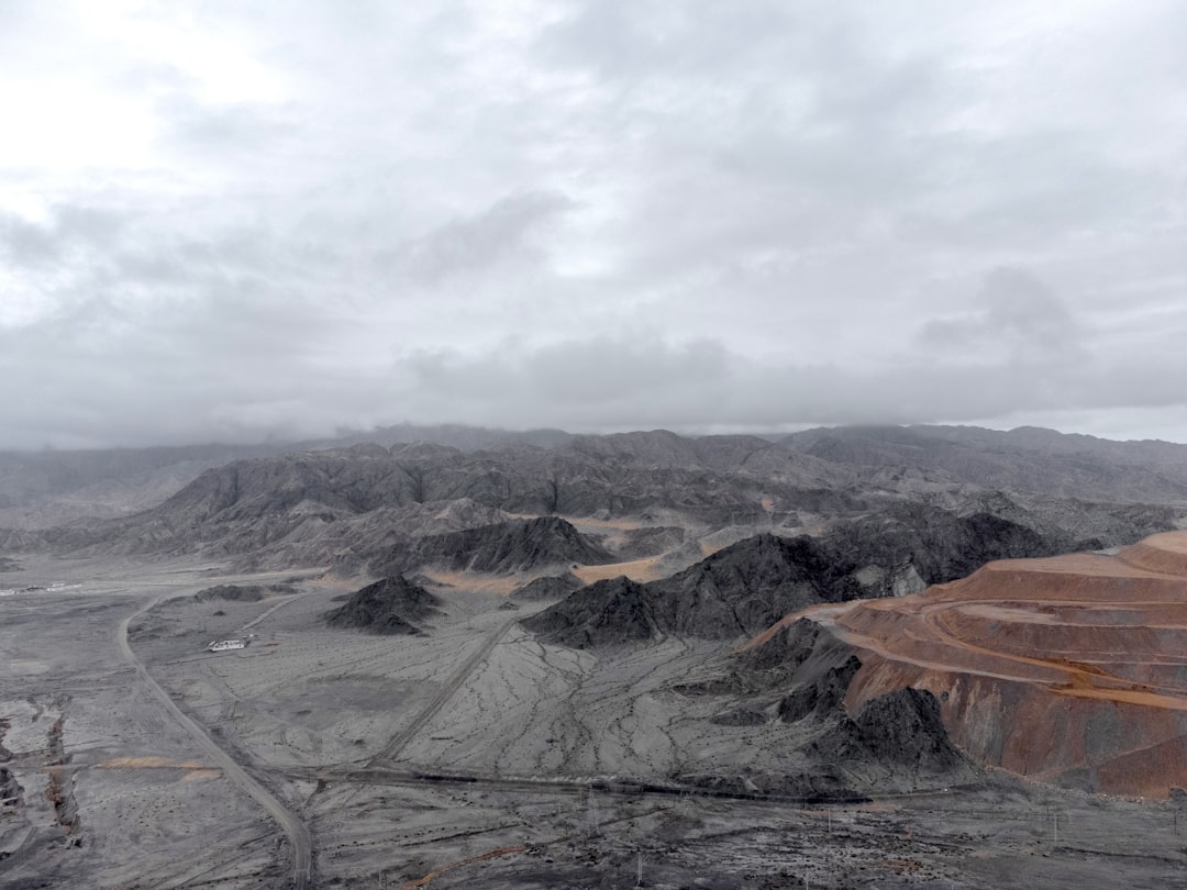 brown and gray mountains under white sky during daytime