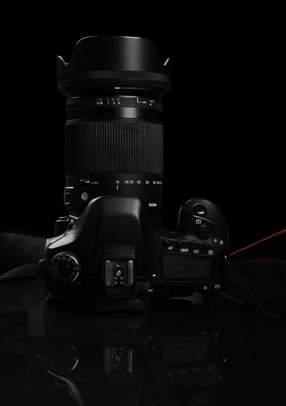 black nikon dslr camera on black surface