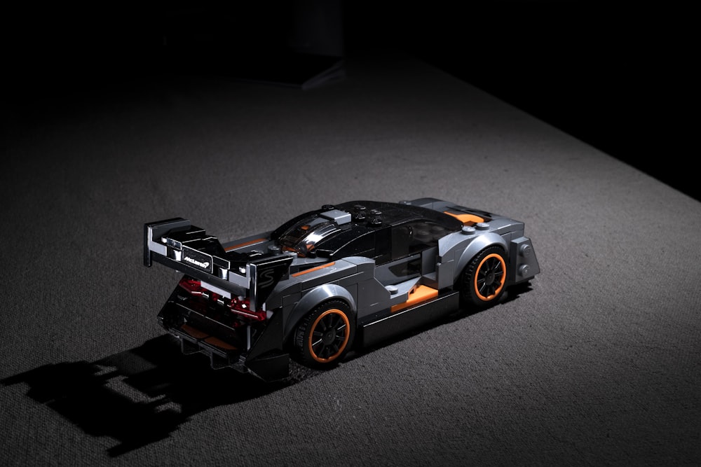 black and orange toy car