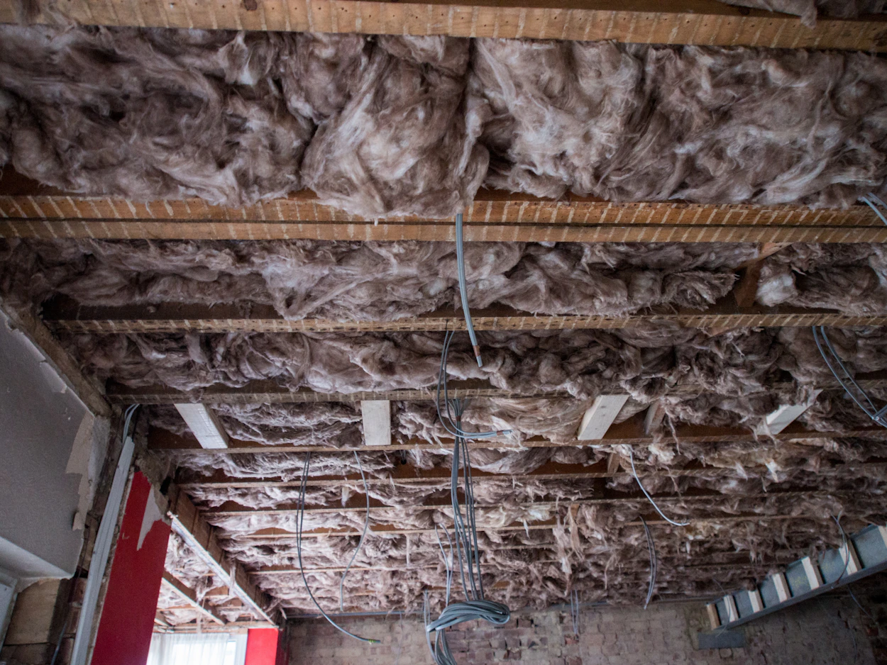 Insulation and wiring in an open ceiling during a remodel