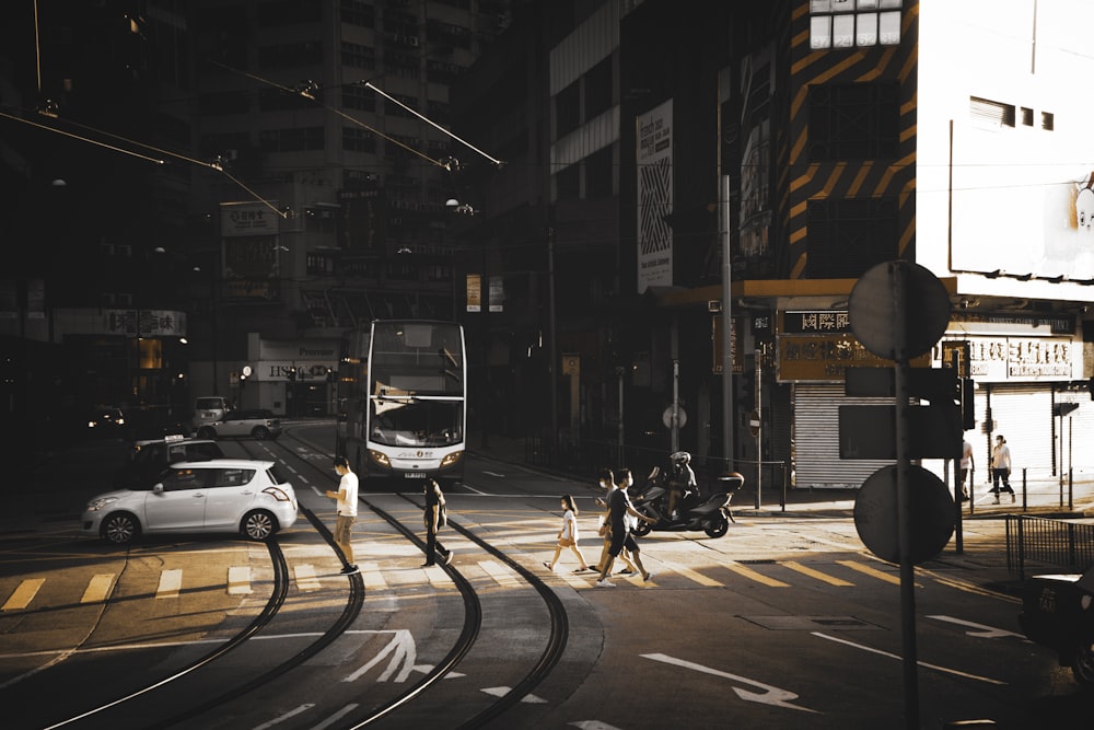 people walking on pedestrian lane during night time