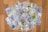 A collection of various banknotes spread out on a wooden surface, including currencies such as U.S. dollars, Euros, and Turkish lira.
