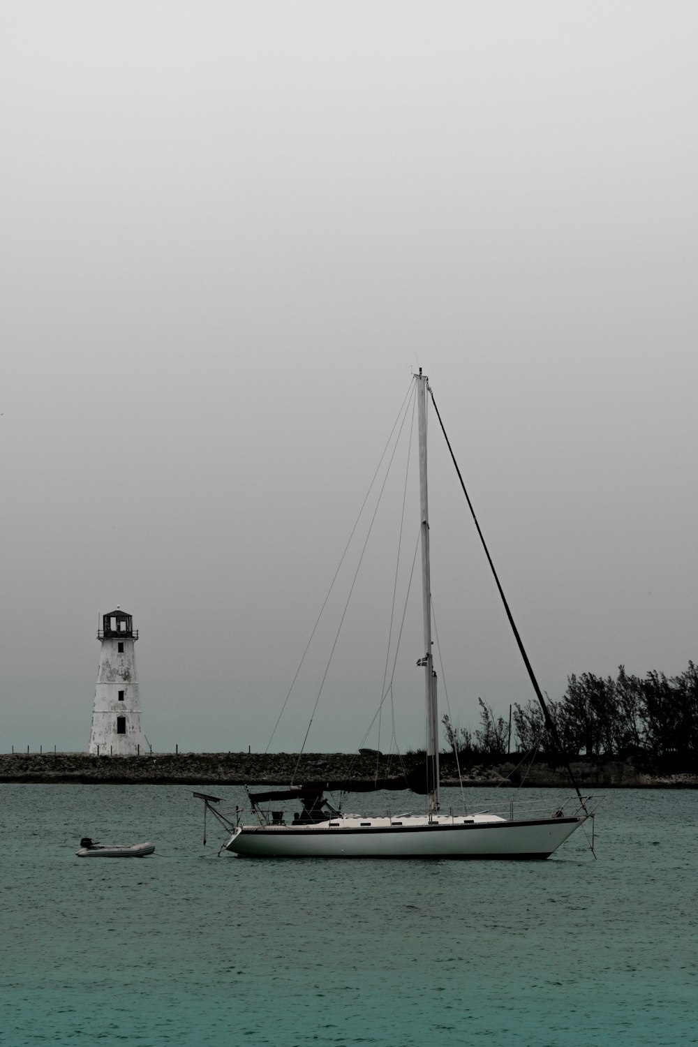 white and blue boat on sea during daytime