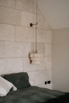 Elegant bedroom with terracotta walls and emerald green accents.