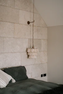 A cozy bedroom featuring textured wallpaper that adds warmth and depth.
