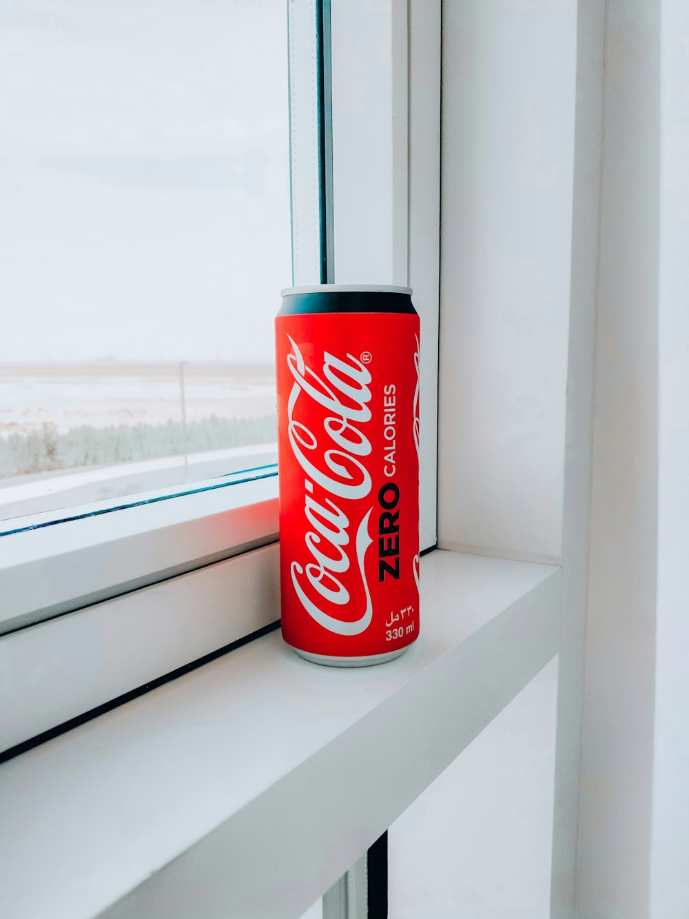 coca cola can on window