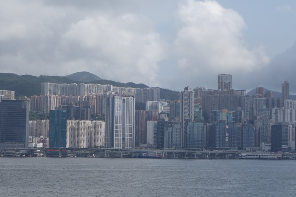 city skyline across body of water during daytime