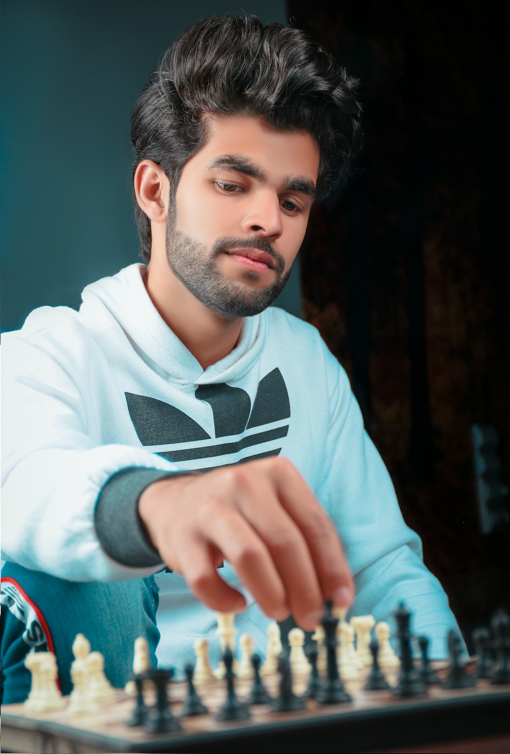 man in white and black adidas sweater