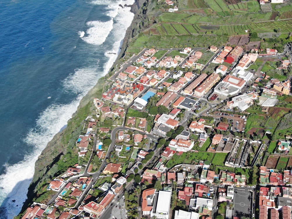 aerial view of city near body of water during daytime