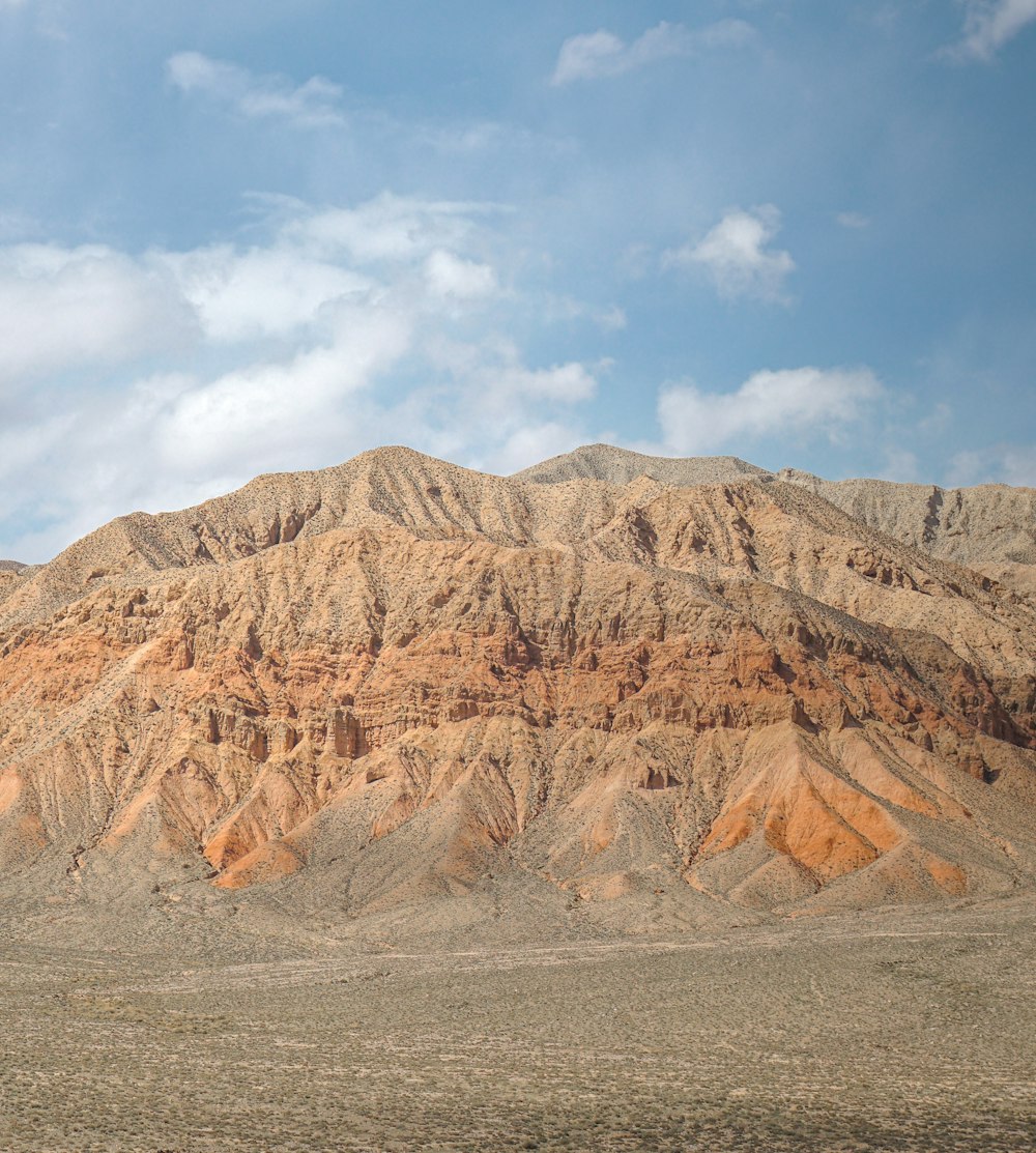 brown rocky mountain under blue sky during daytime