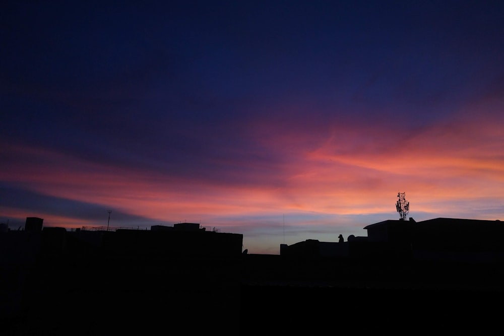 silhouette of building during sunset