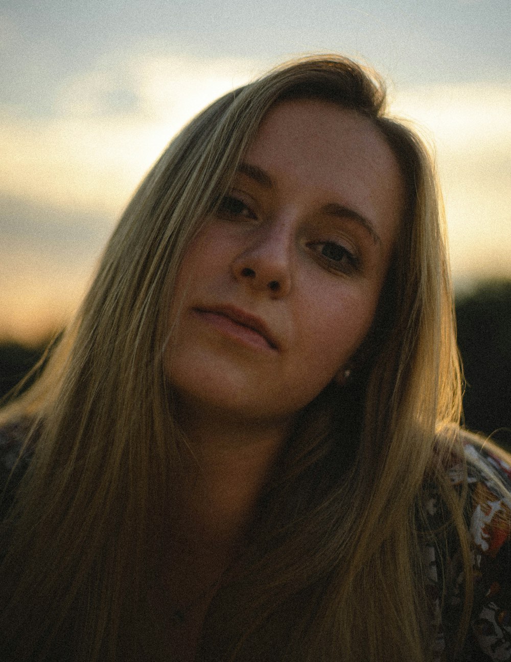 woman in brown and white shirt