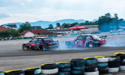 red and blue racing car on race track during daytime