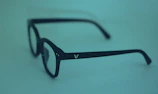 Stylish pair of blue light blocking glasses with gold frames on a clean white background.