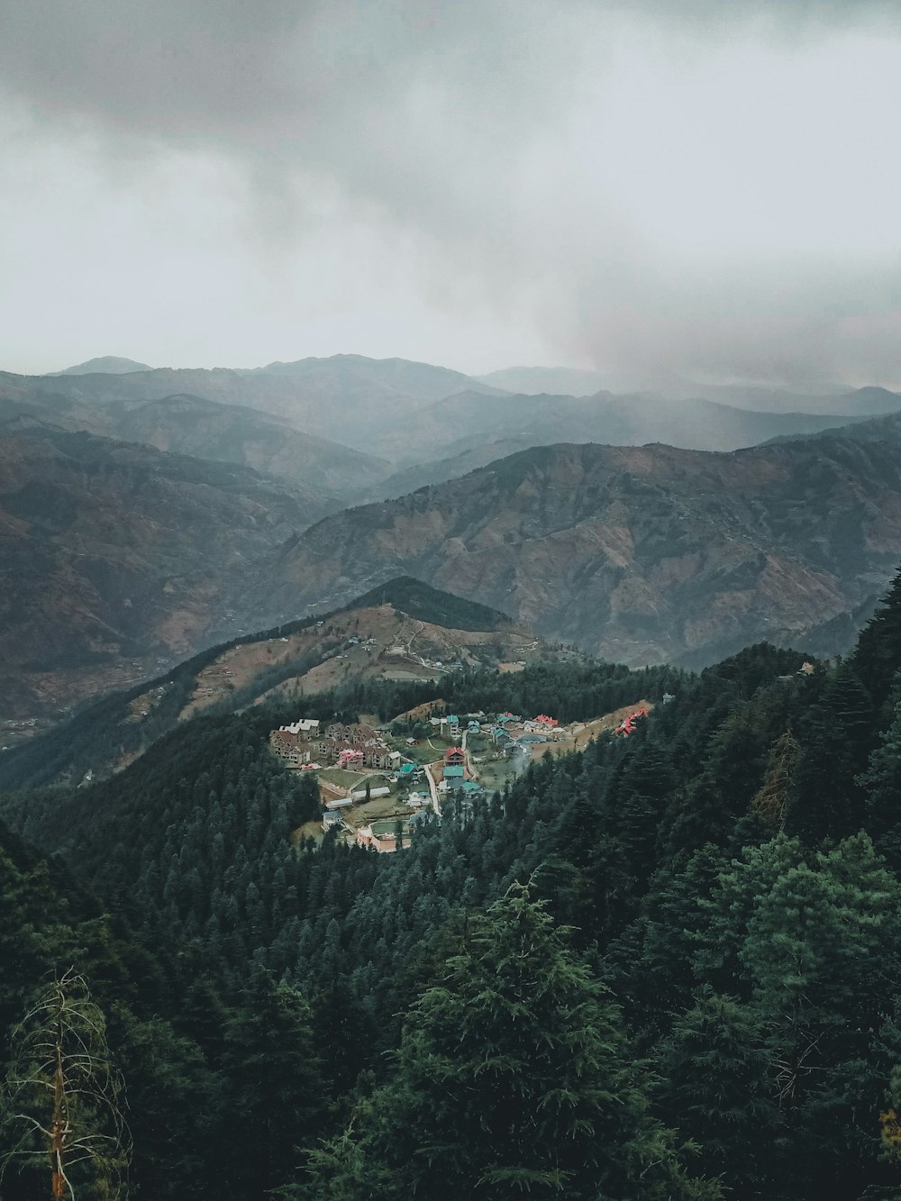 aerial view of city near mountain during daytime