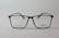 A pair of rectangular eyeglasses with a thin black frame, featuring the brand name 'Silhouette' on the right lens. The lenses are transparent, and small text is present on the left lens.