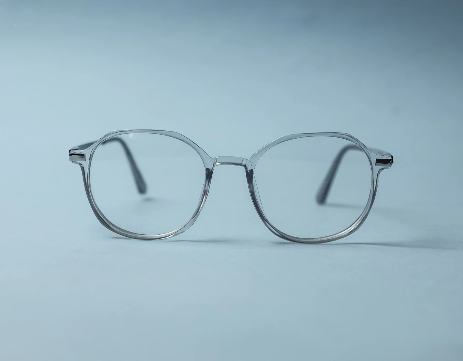 Clear acetate frame on a grey surface