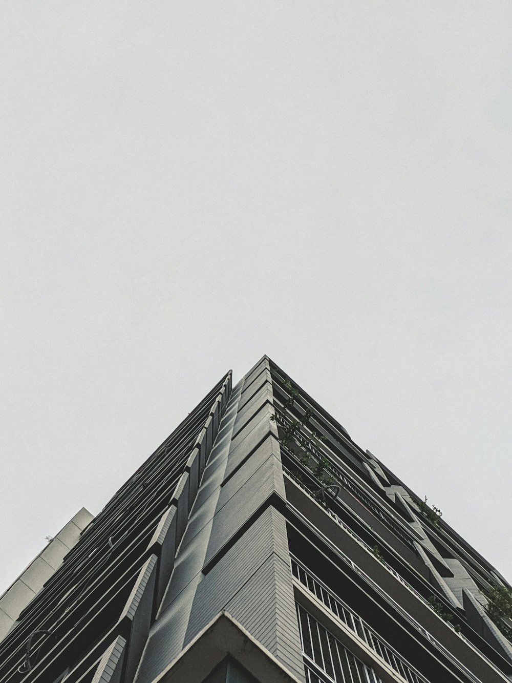 low angle photography of gray concrete building