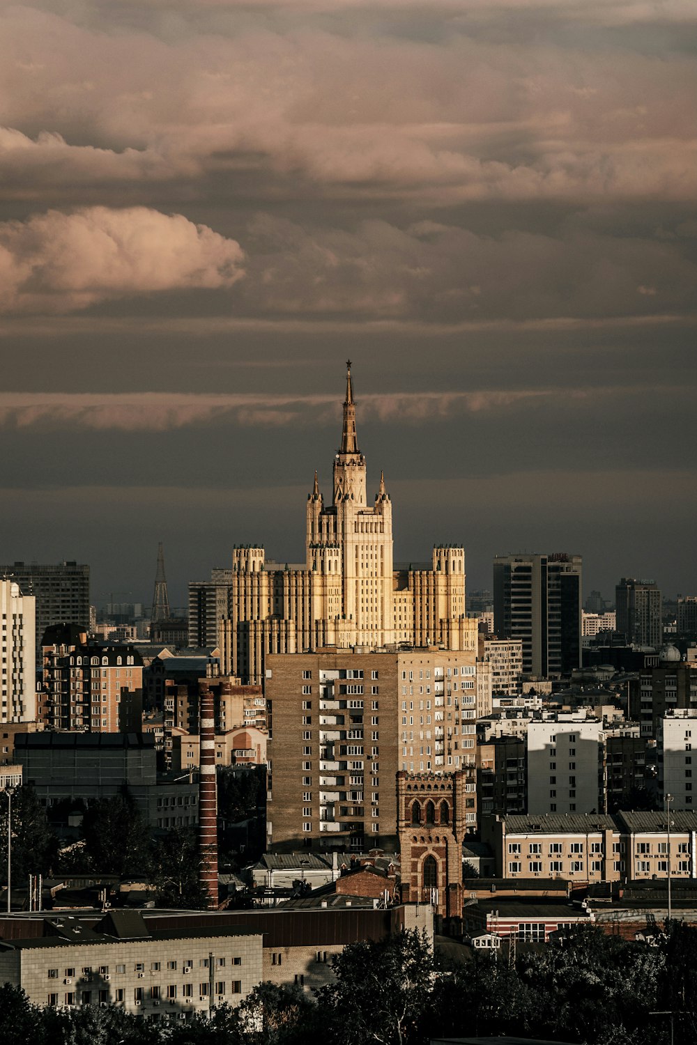 city skyline under cloudy sky during daytime