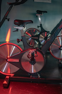 red and black bicycle on black floor