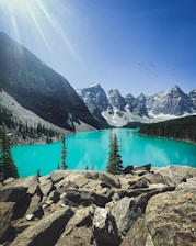 lake in the middle of mountains during daytime
