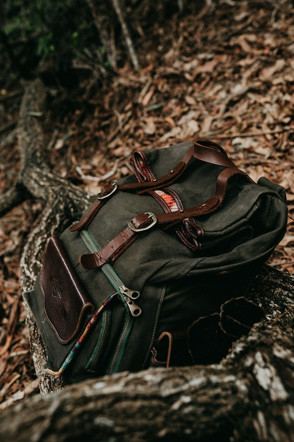 black and brown leather backpack
