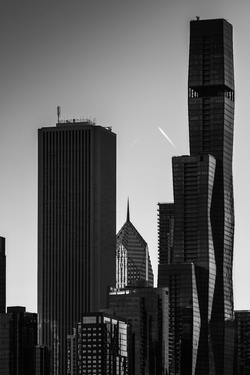 grayscale photo of high rise buildings