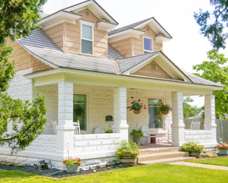 Image 6: white and brown concrete house