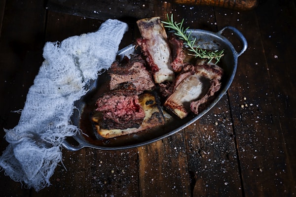 Grilled meat on black pan