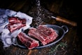 sliced meat on black wooden table