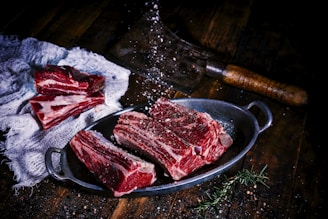 sliced meat on black wooden table