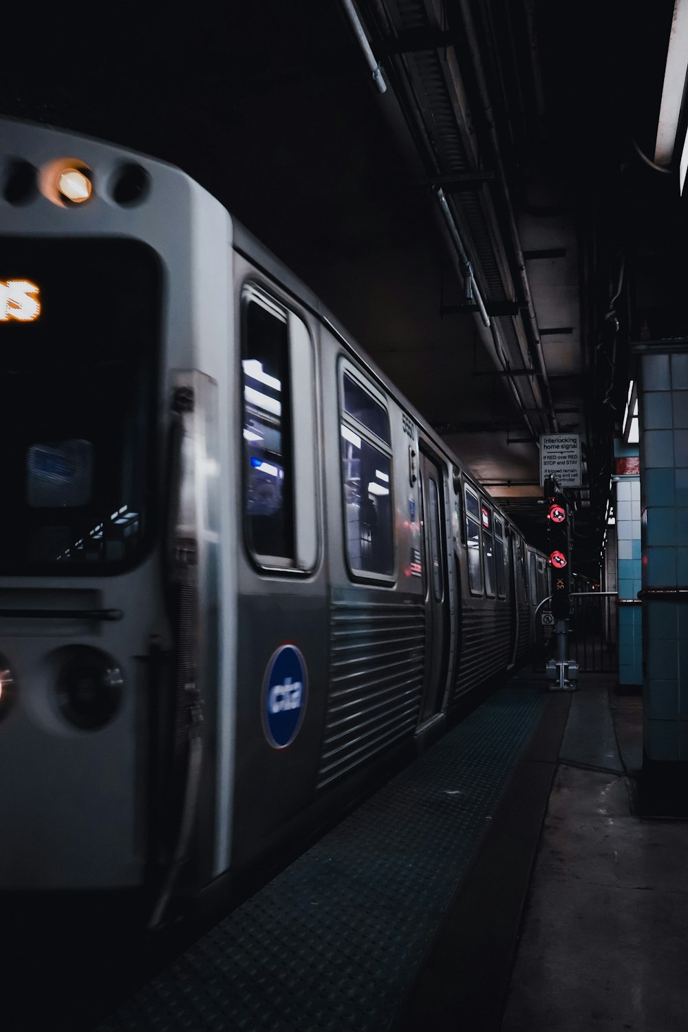 white and black train on train station