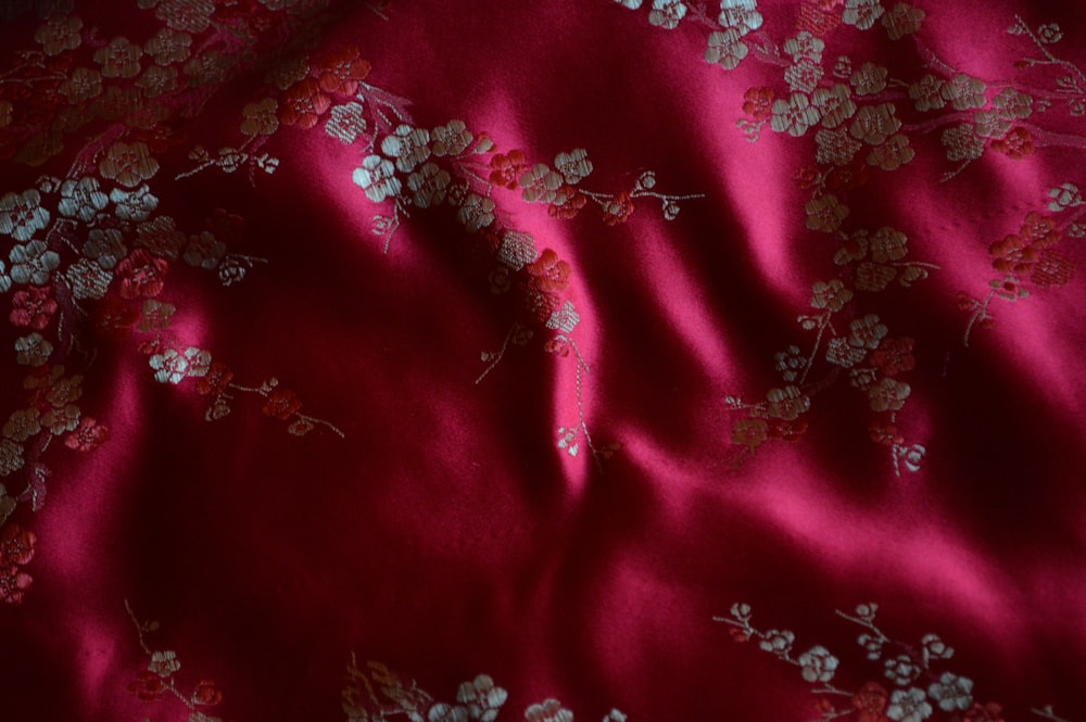 red and white floral textile