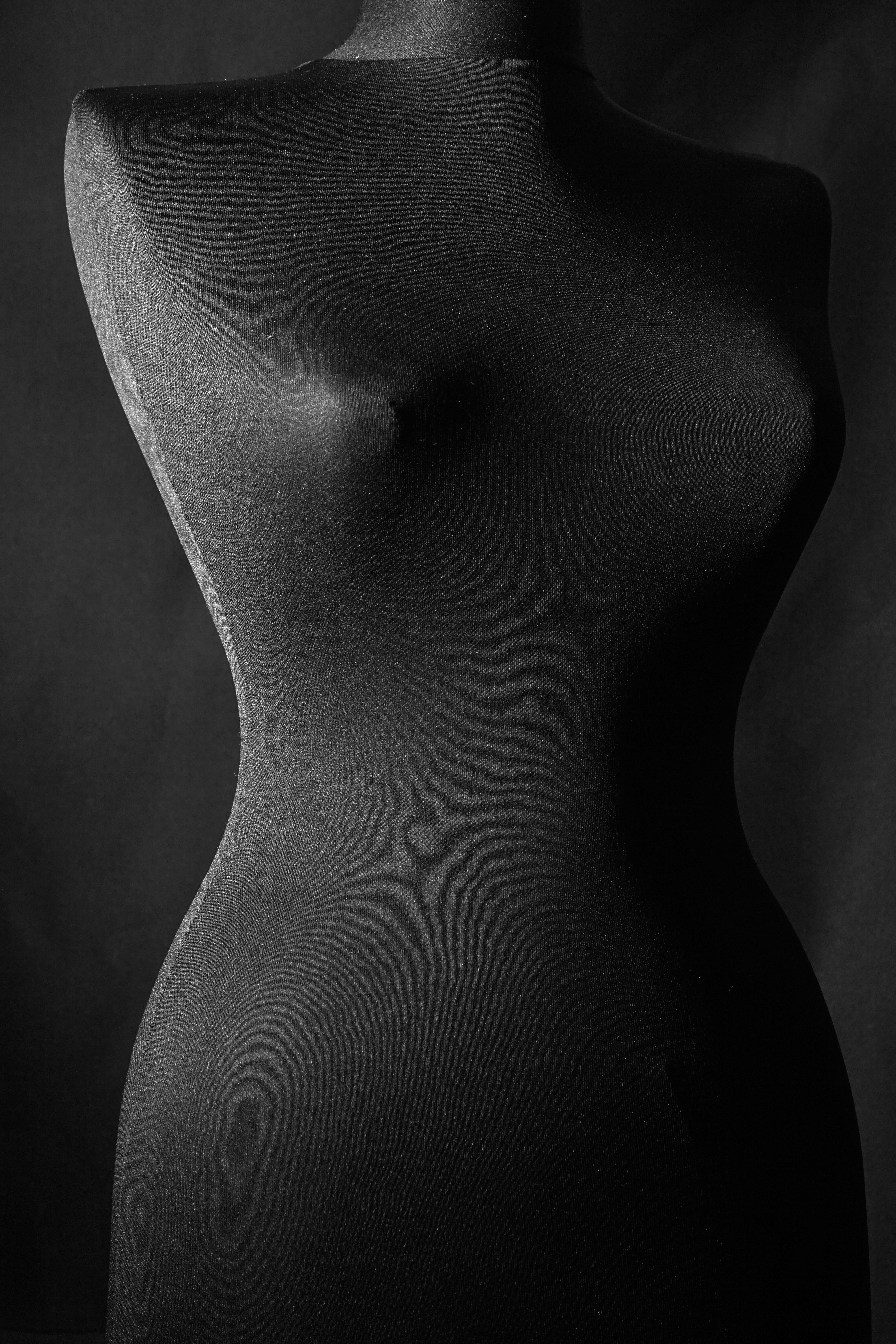 womans breast in grayscale
