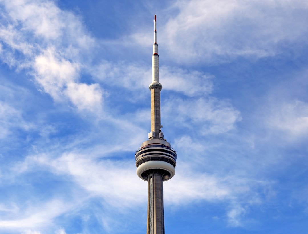 white and black tower under blue sky