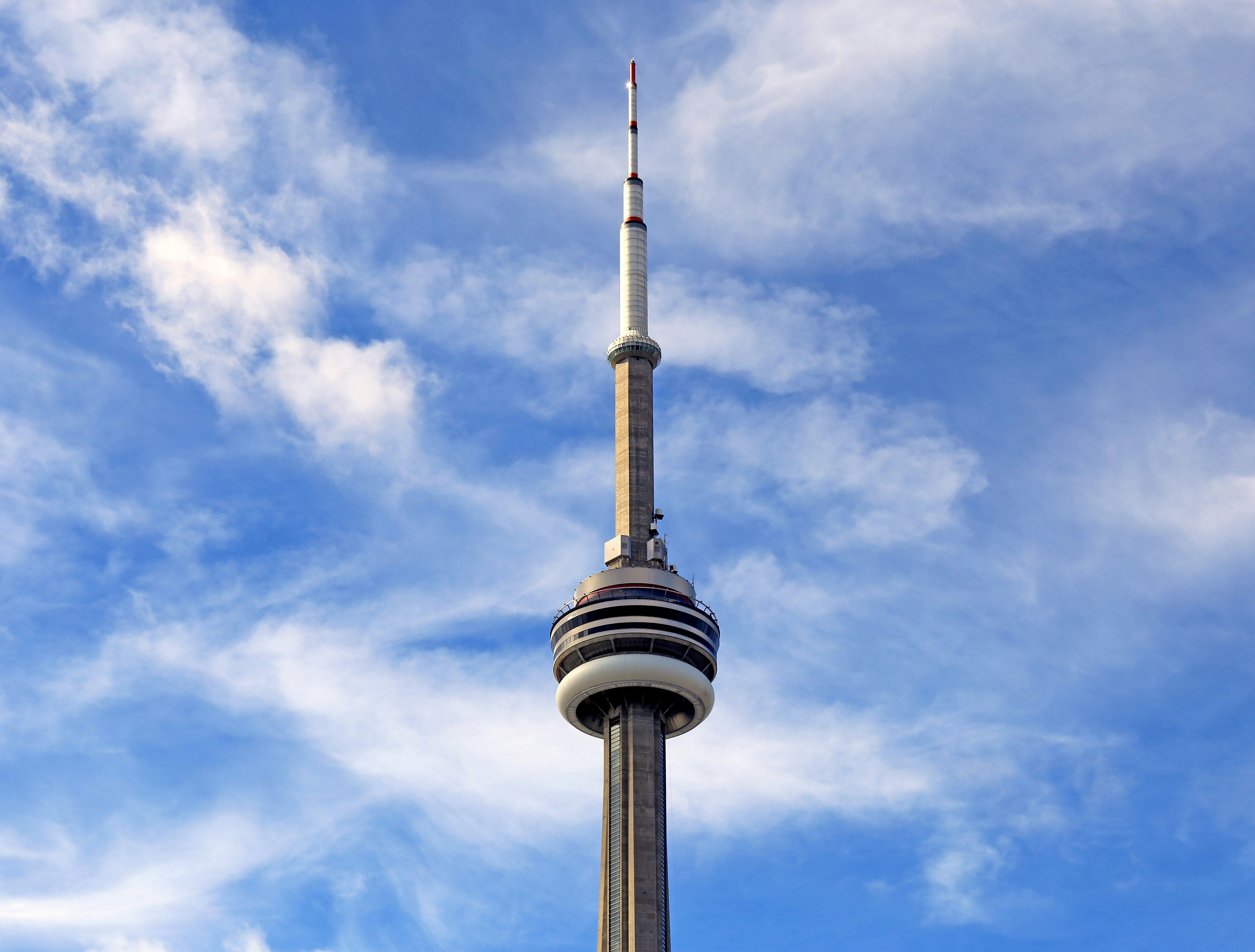 white and black tower under blue sky