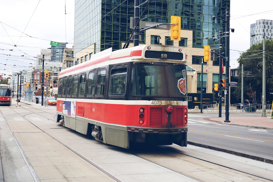 A classic red and white TTC streetcar in downtown Toronto