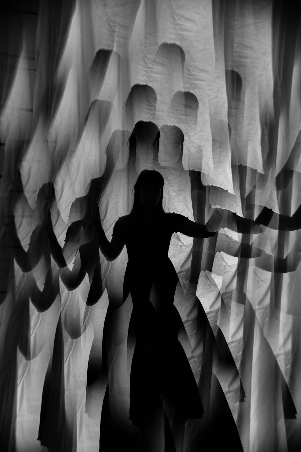 silhouette of man in a white curtain